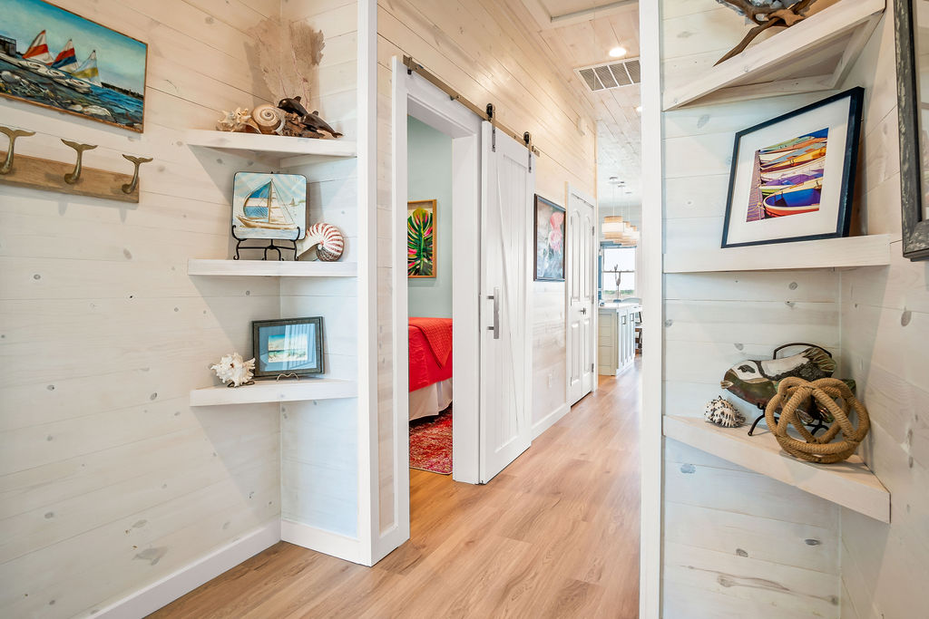 Hallway with built-in coastal shelving